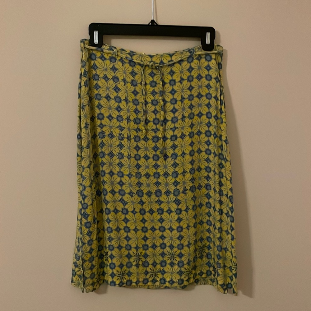 Beautiful print summer skirt with beading on the bottom flowers.